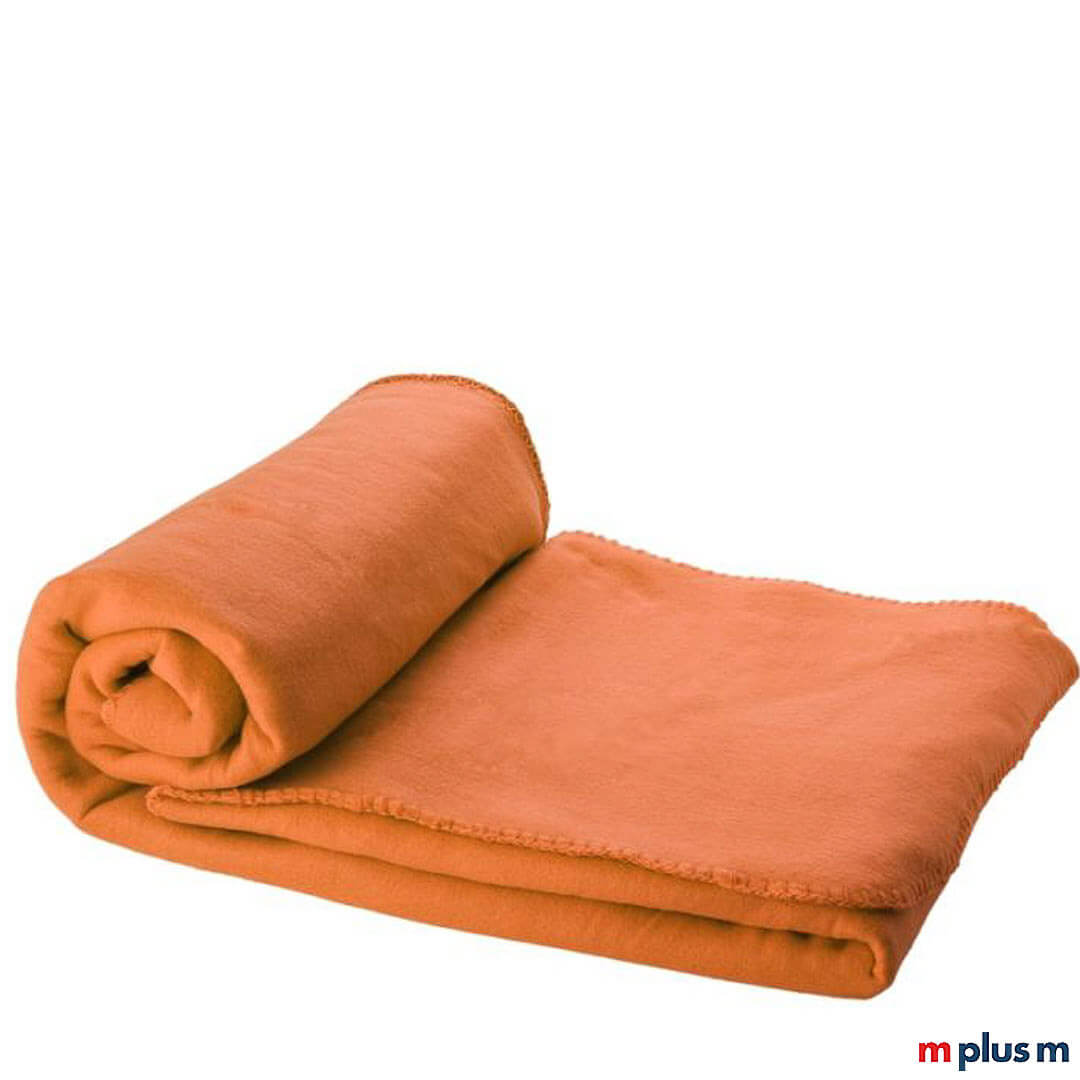 Die orangene 'Huggy' Decke besteht aus weichem und bequemem Polarfleece. Ab einer Menge von 50 Stück können Sie die Decke bedrucken lassen